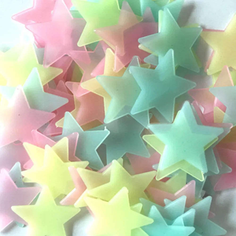 100pcs Fluorescent Glow in the Dark Stars Wall Stickers illuminating a bedroom ceiling.